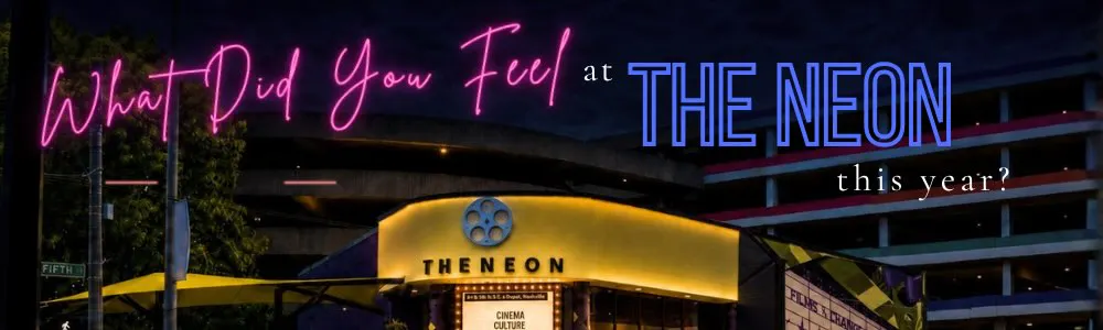 Promo graphic asking "What Did You Feel at The Neon This Year?" in neon-style pink and blue lettering, over a nighttime photo of The Neon movie theater. The lit marquee reads "Cinema, Culture, Community," with a parking structure behind and a film-reel mural on the right.