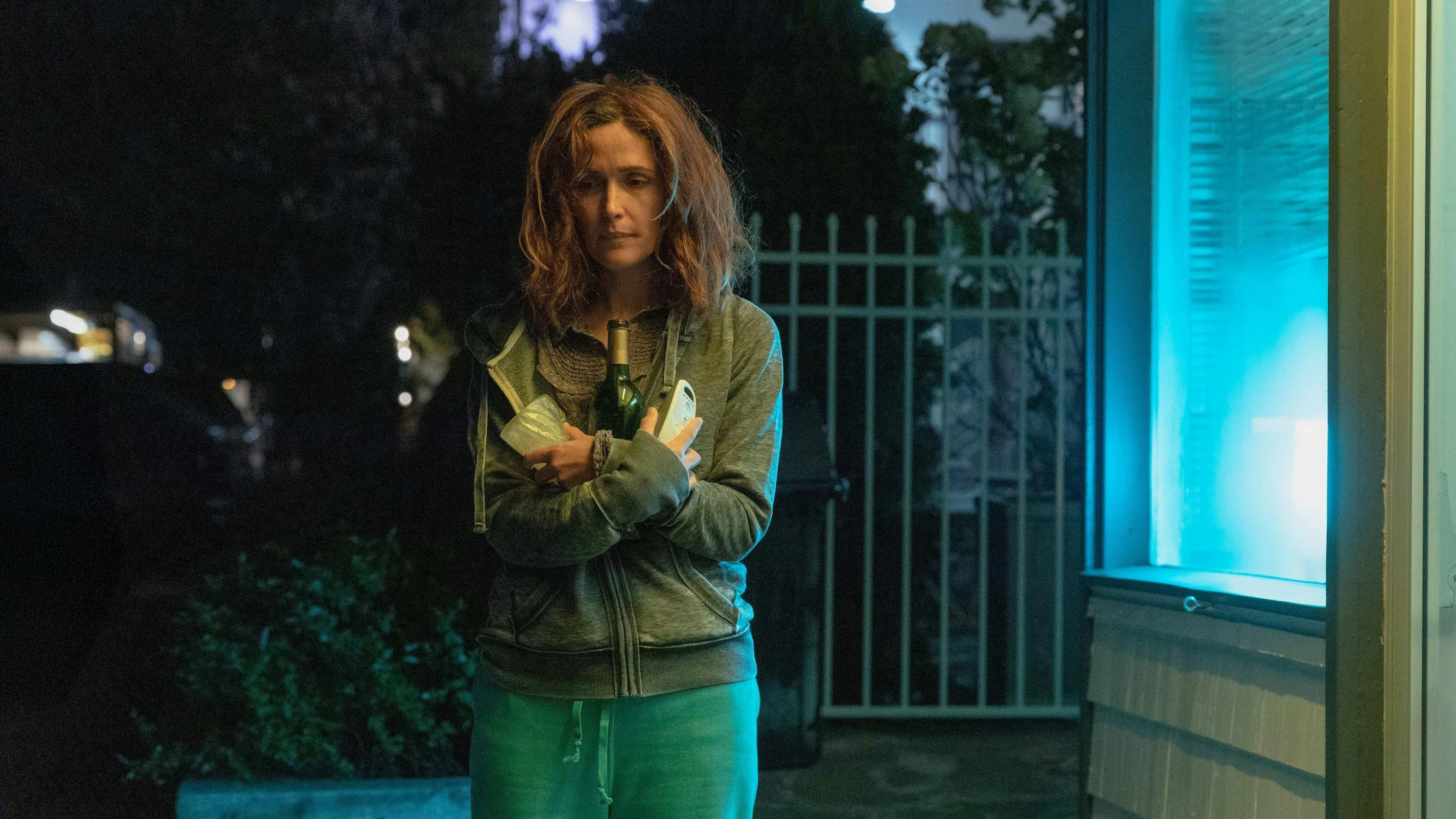 Two friends chasing floating legs in a red room from House, 1977