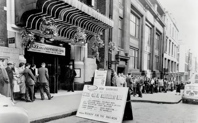 Cinema Patrons queuing outside the Cosmo. The cinema was rebranded as the GFT in 1974.