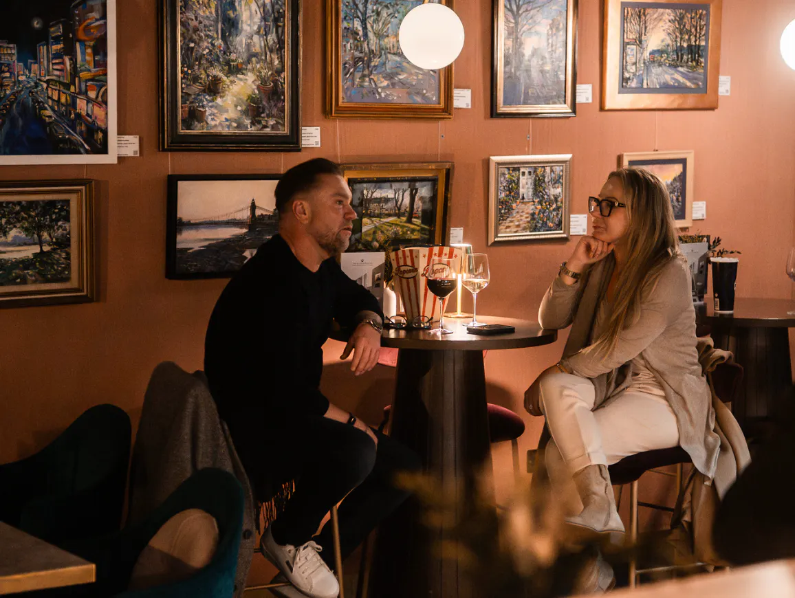 The Chiswick Cinema main bar with customers buying from a range of snacks.