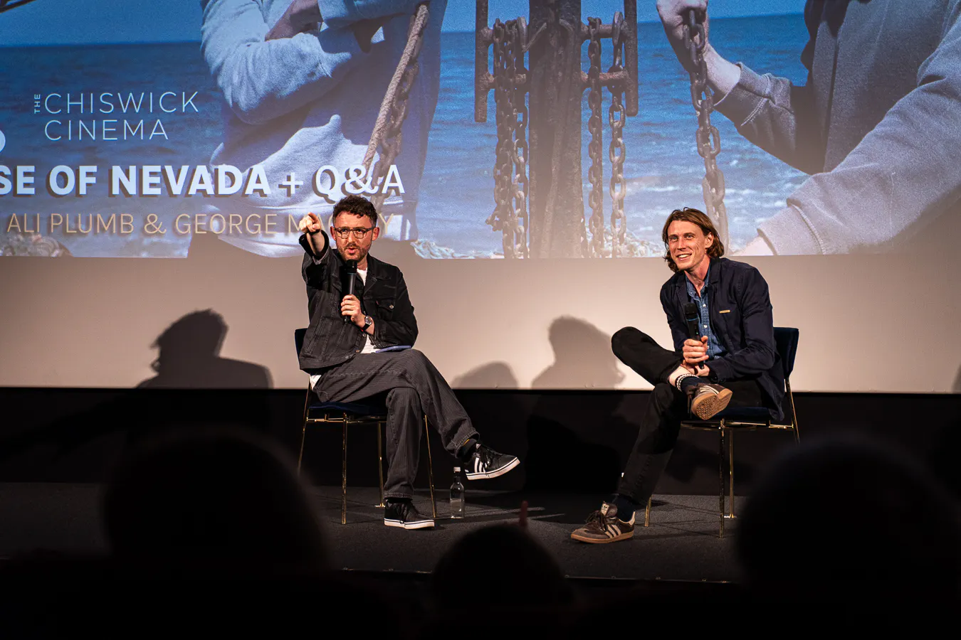 George MacKay speaks to Andrea Carnevali, smiling on stage at Chiswick Cinema.