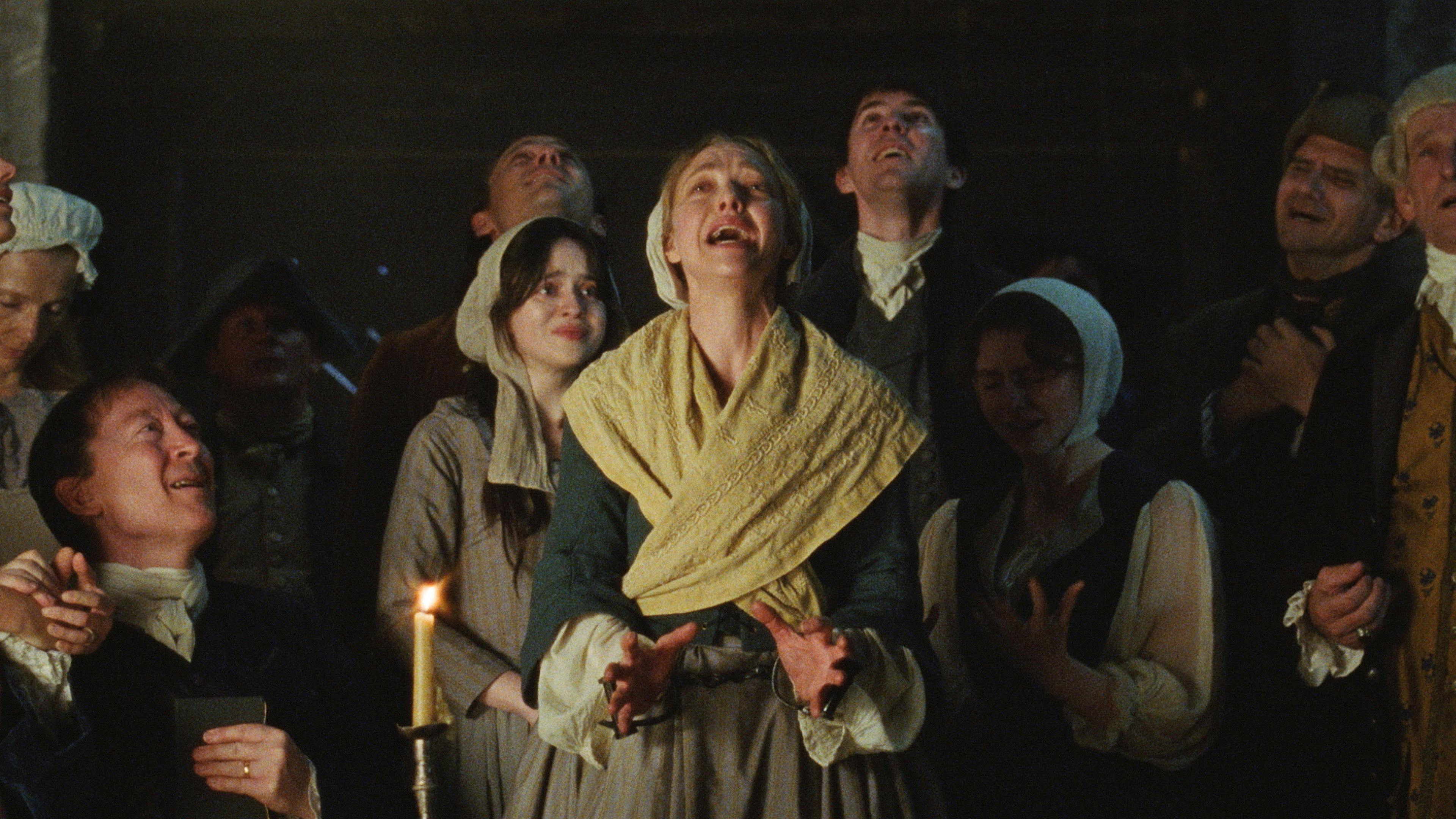 Two friends chasing floating legs in a red room from House, 1977