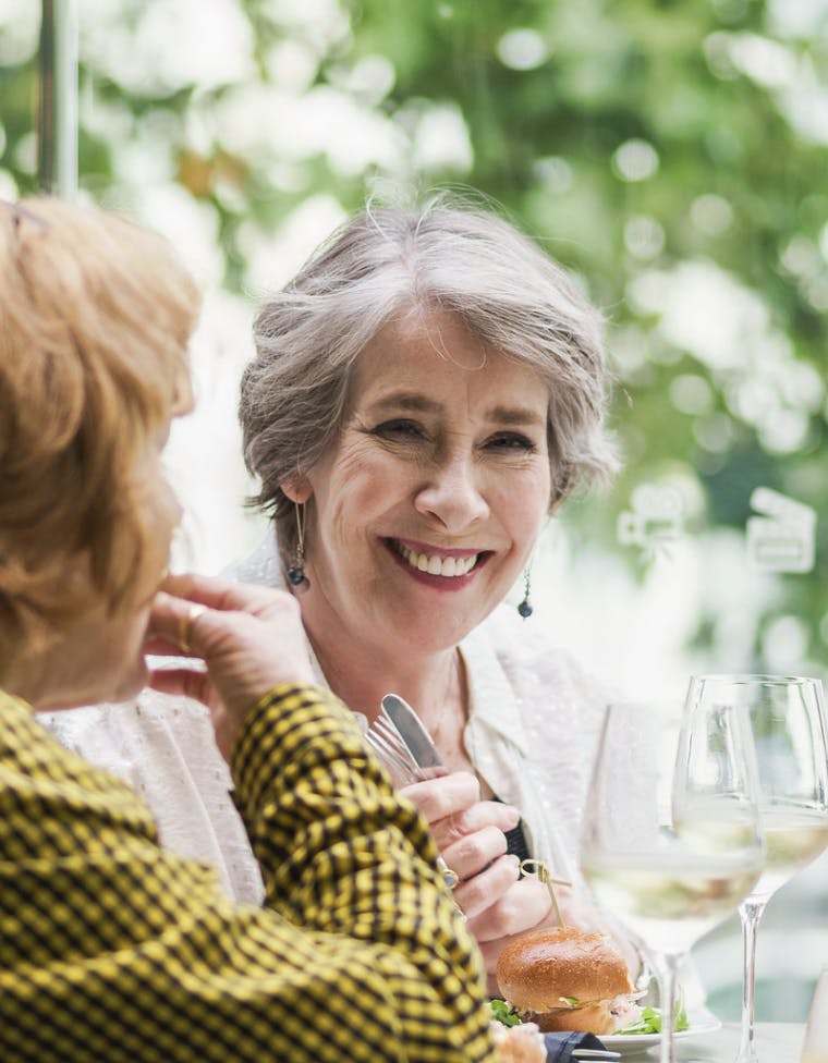Phyllis Logan laughs while enjoying wine on the outside terrace of the cinema.