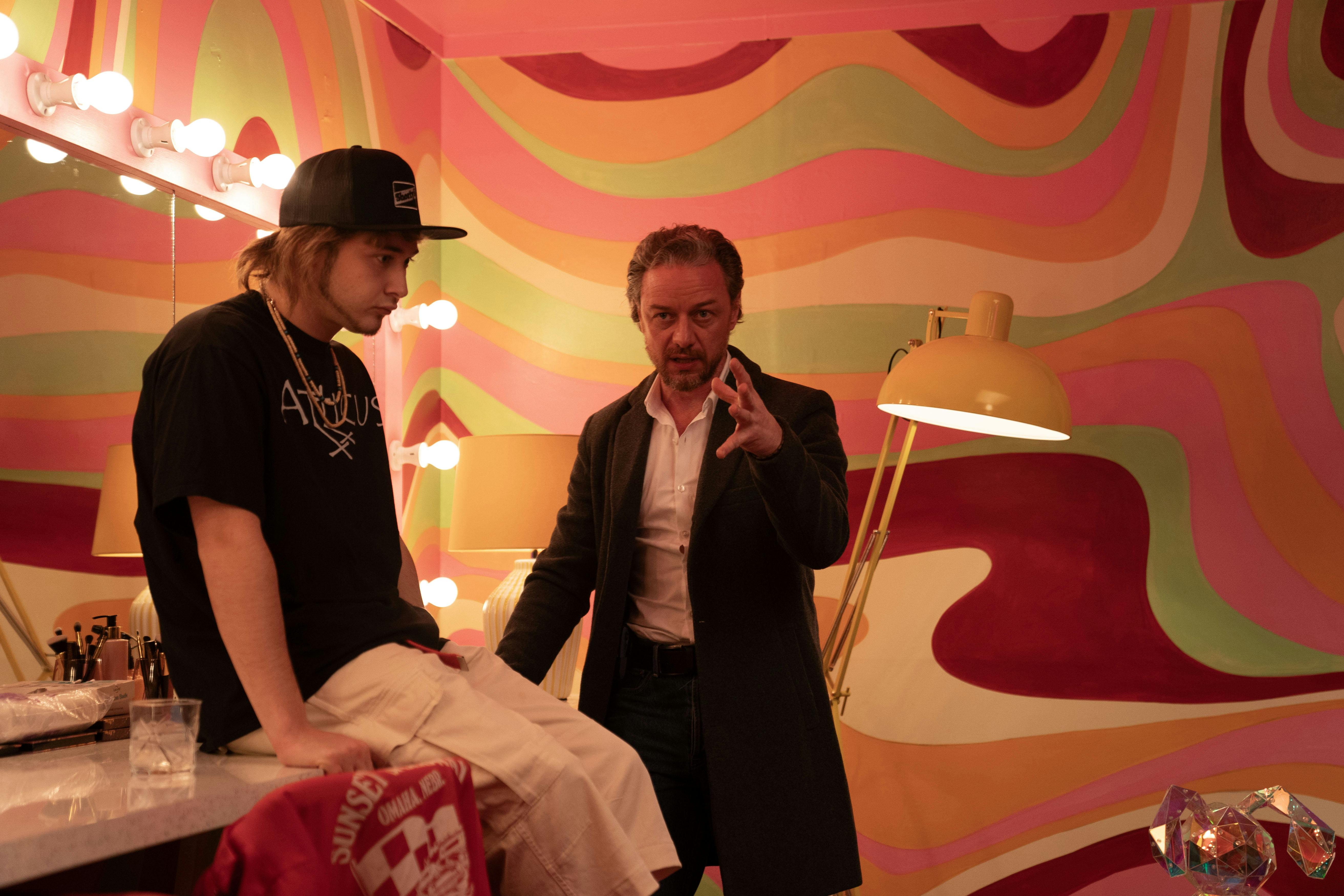 Robert Redford and Dustin Hoffman seated at newsroom desks in All The President's Men.