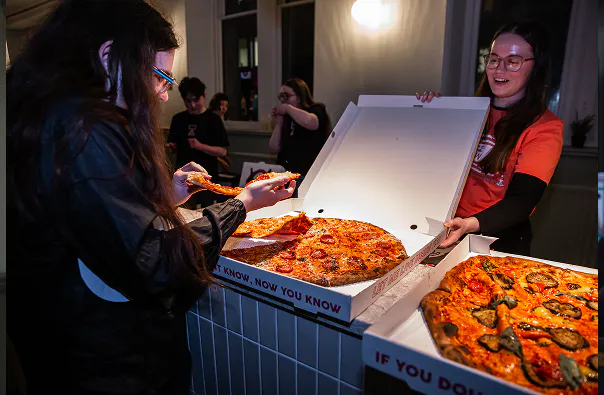 People in costume posing at a community film event