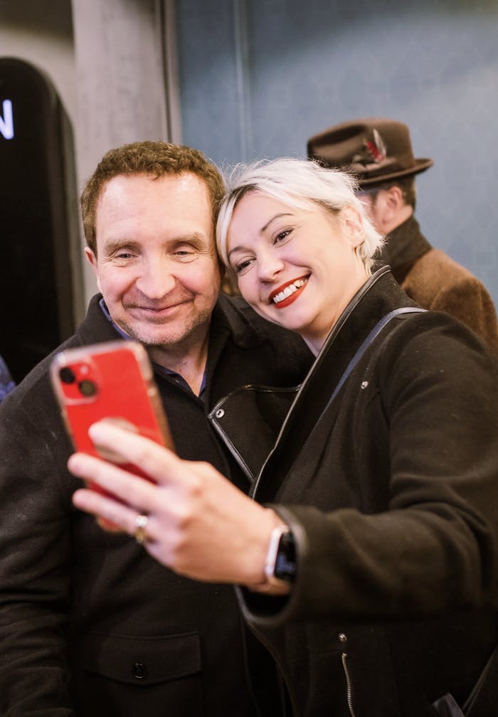 Eddie Marsan takes a selfie with a smiling fan at the cinema.