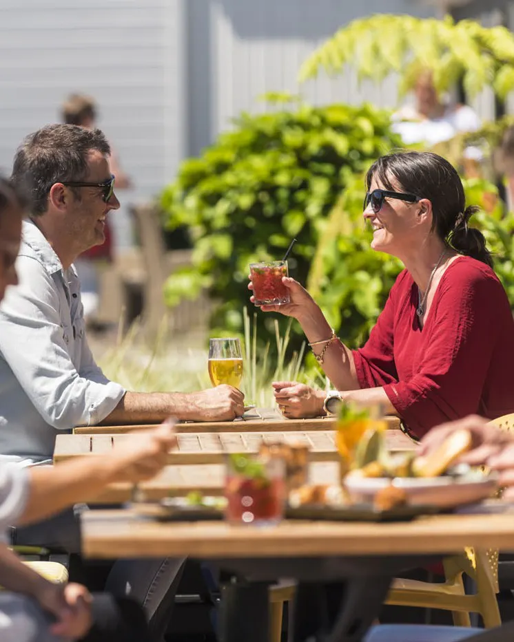 Guests enjoying food and wine on The Screening Room deck