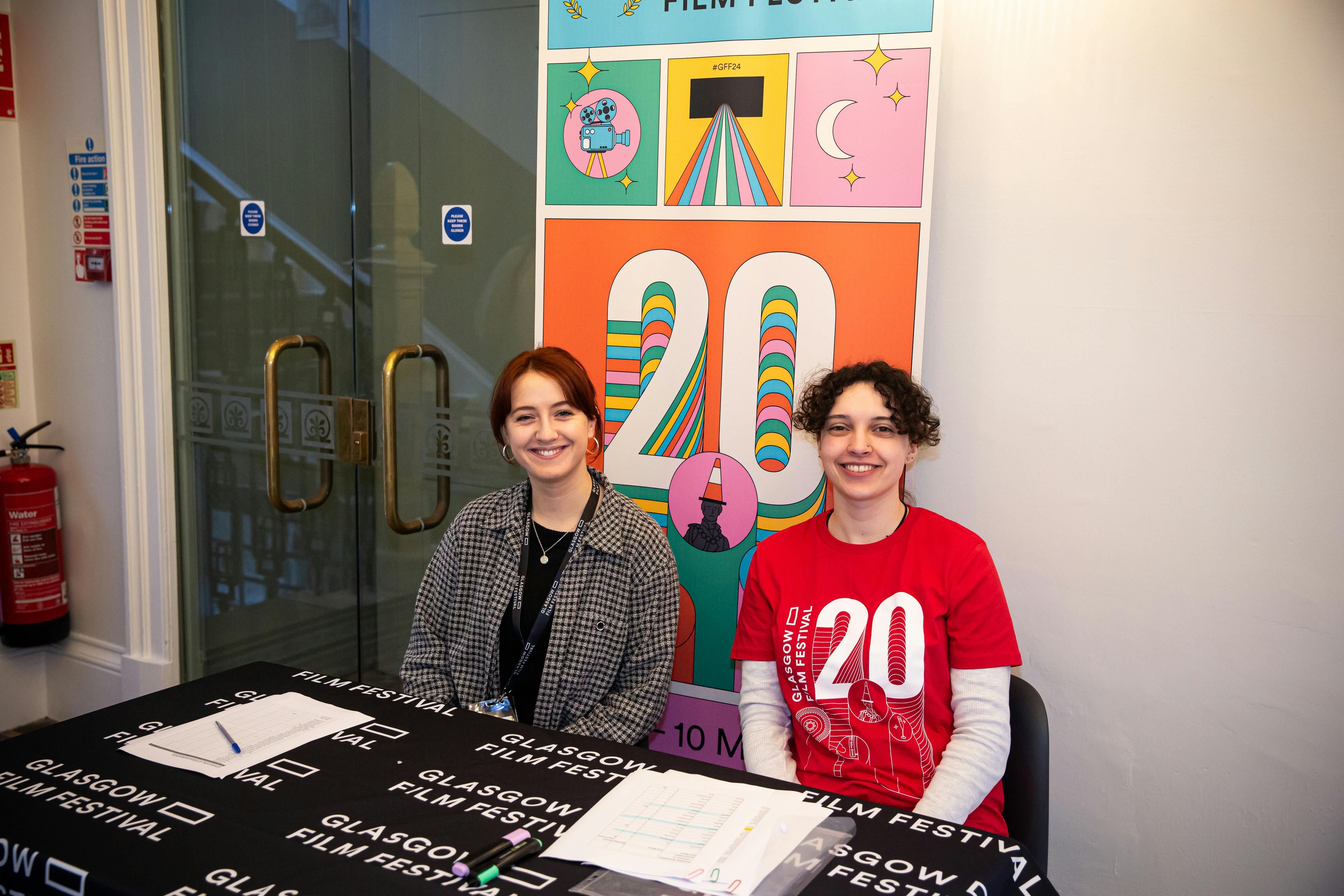 Volunteer helping guests at a pop-up activation