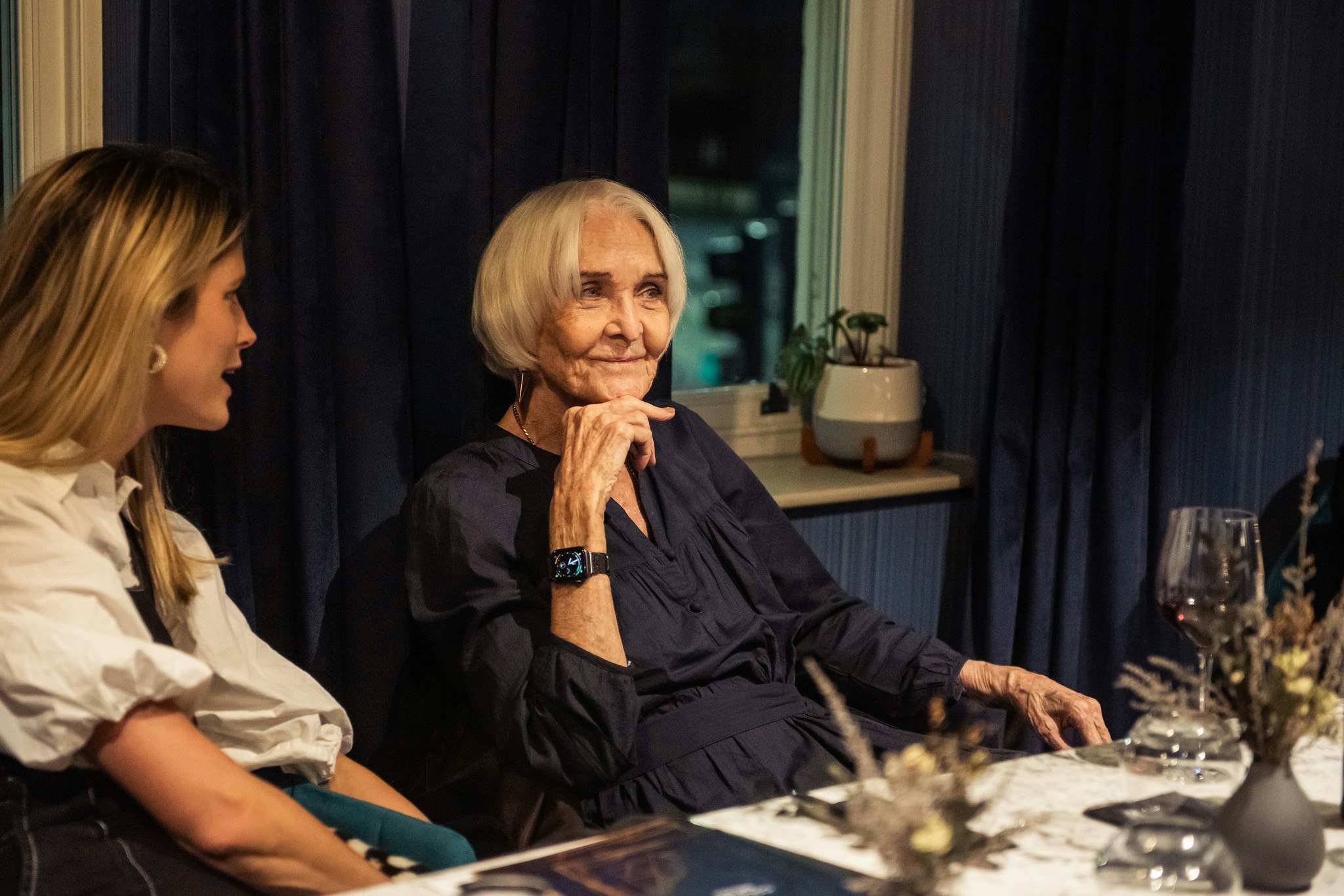Dame Sheila Hancock smiles in conversation in the Lounge bar.