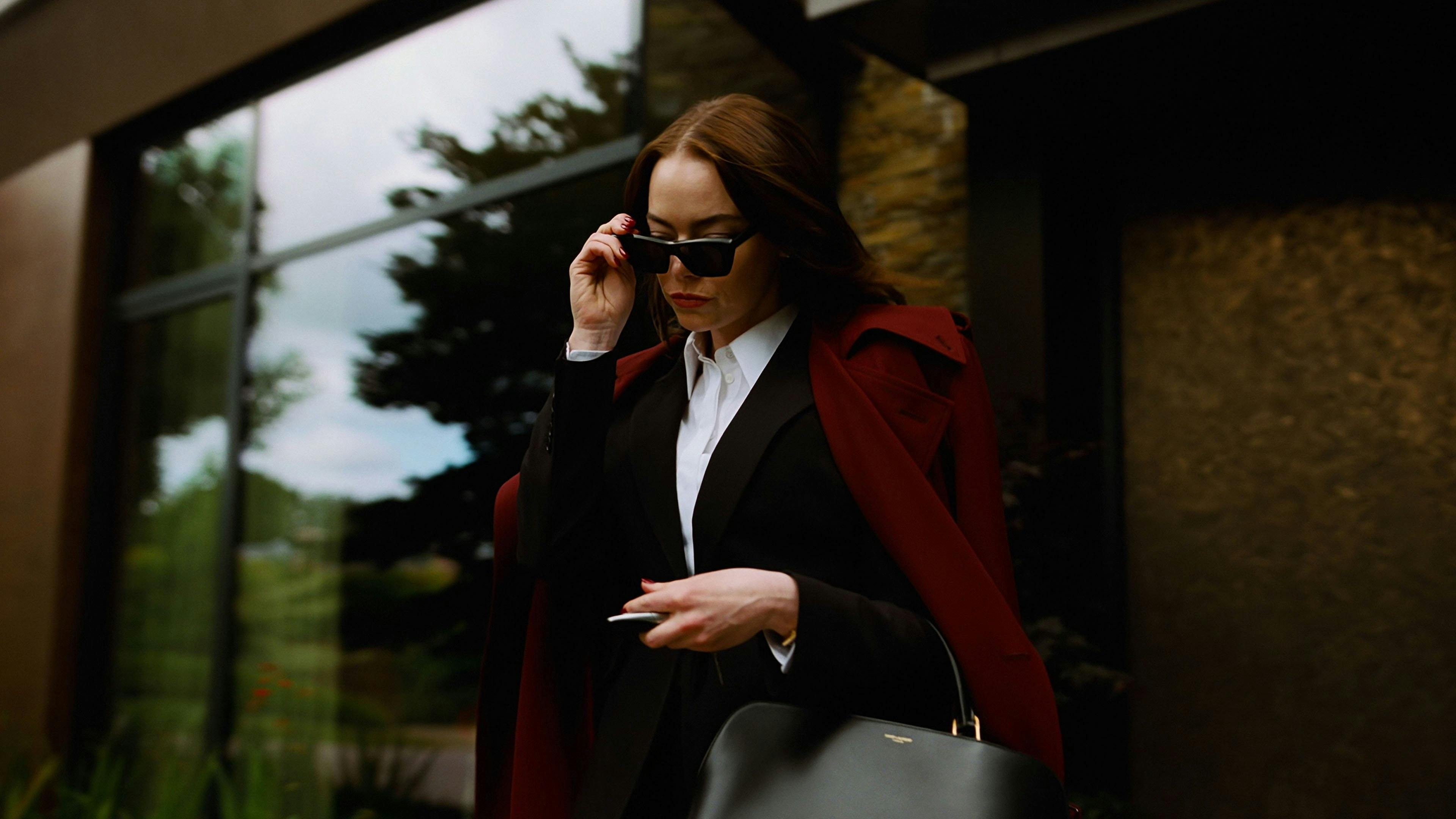 Two friends chasing floating legs in a red room from House, 1977