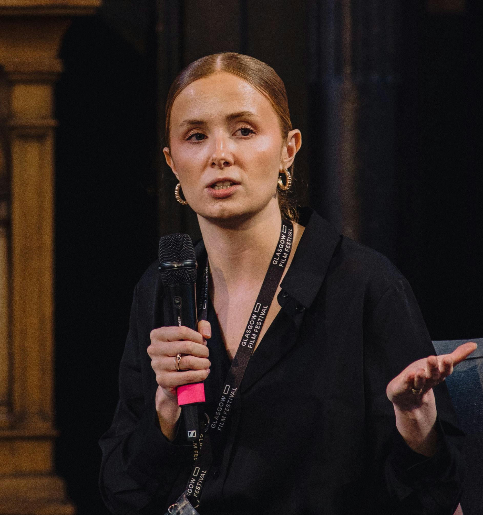 Paul Gallagher seated in a cinema auditorium