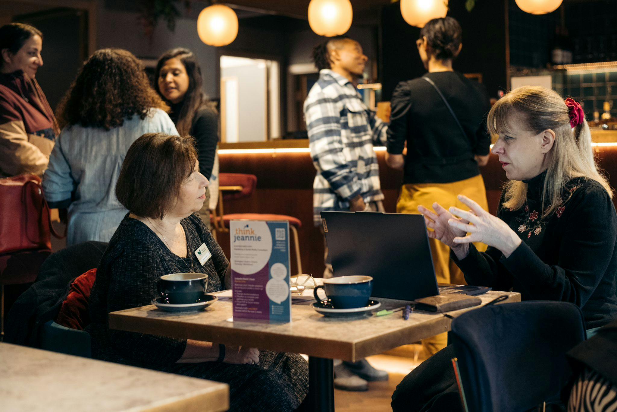 Guests network and talk in the cinema Lounge bar over a coffee.