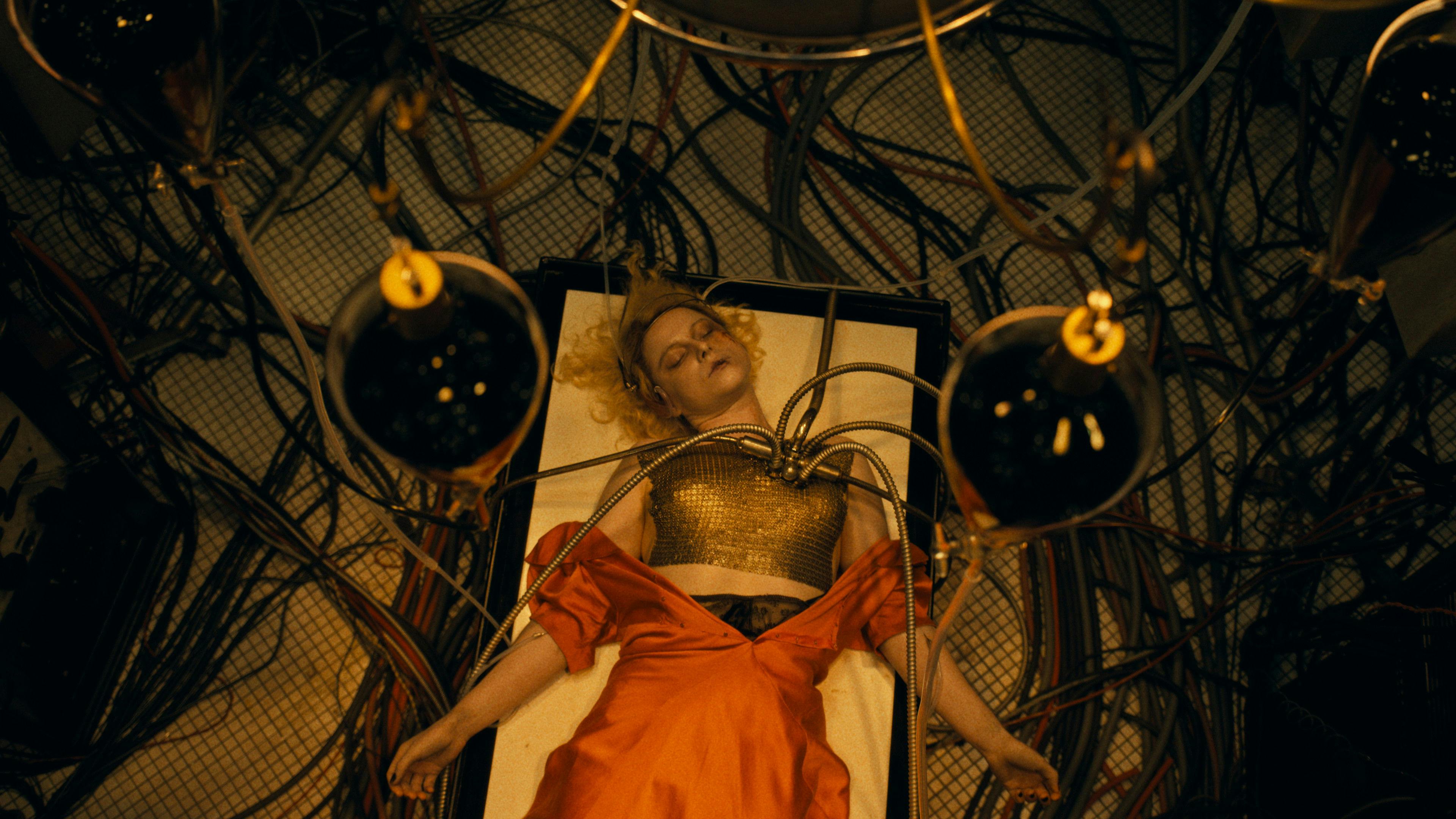 Two friends chasing floating legs in a red room from House, 1977