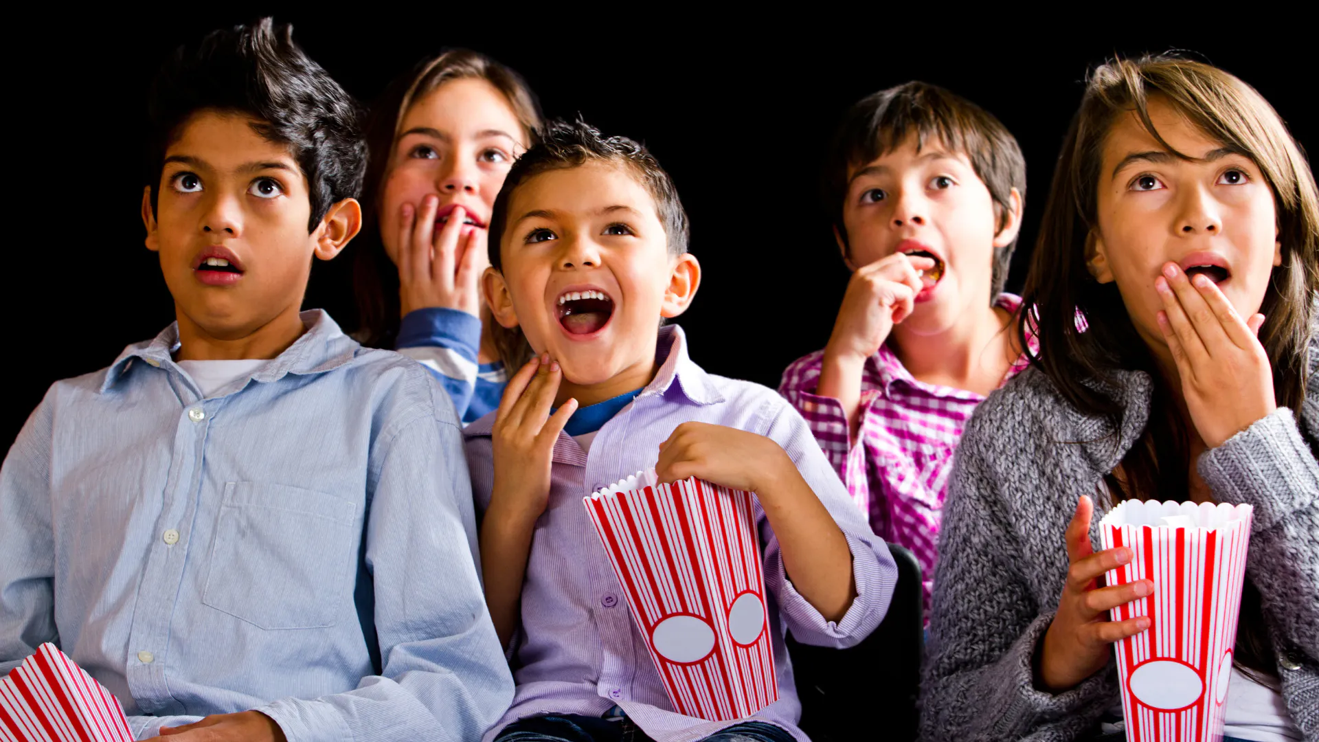 Kids at the movies with popcorn