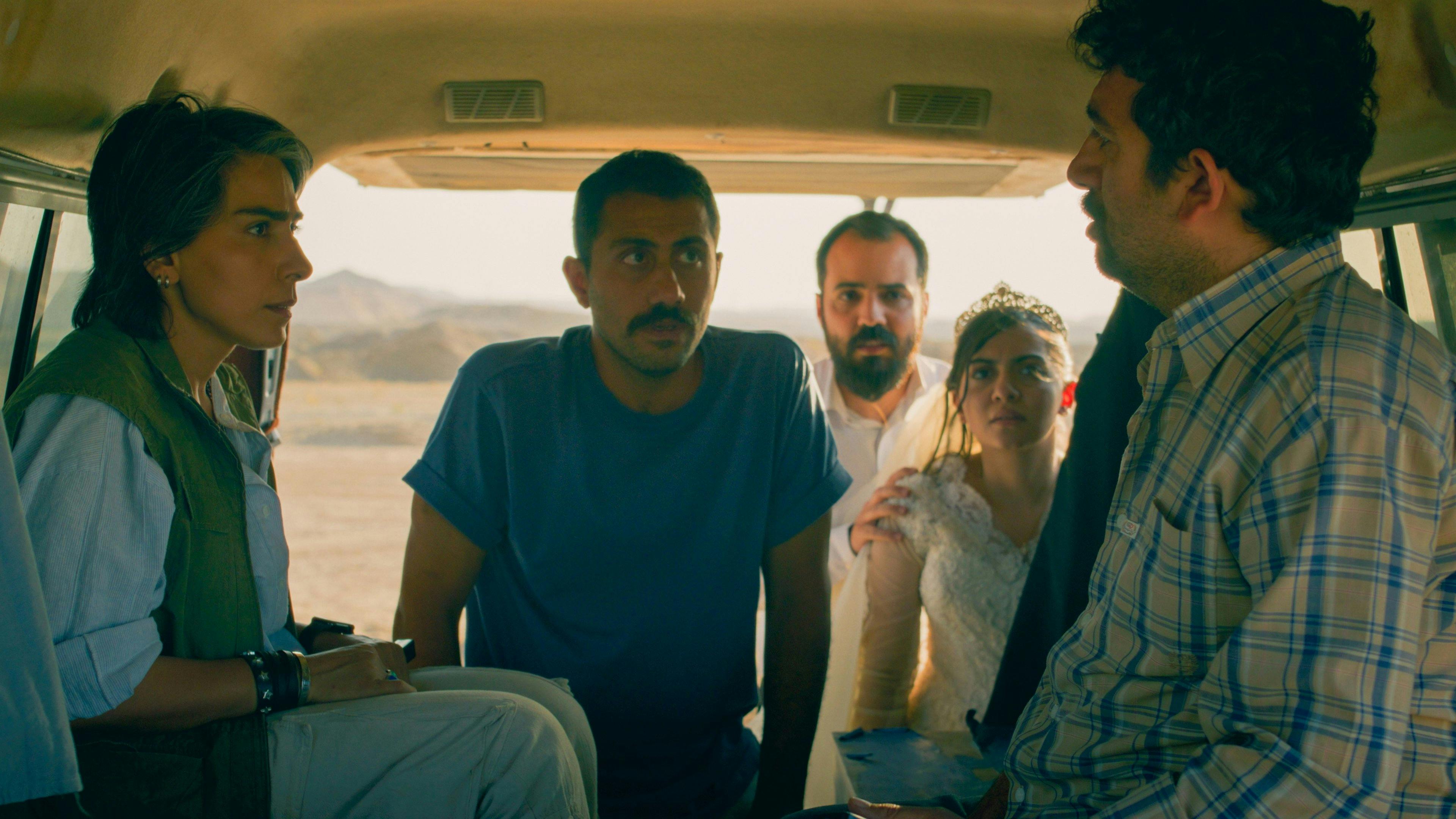 Two friends chasing floating legs in a red room from House, 1977