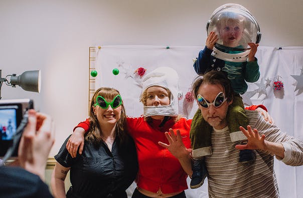 People in costume posing at a community film event