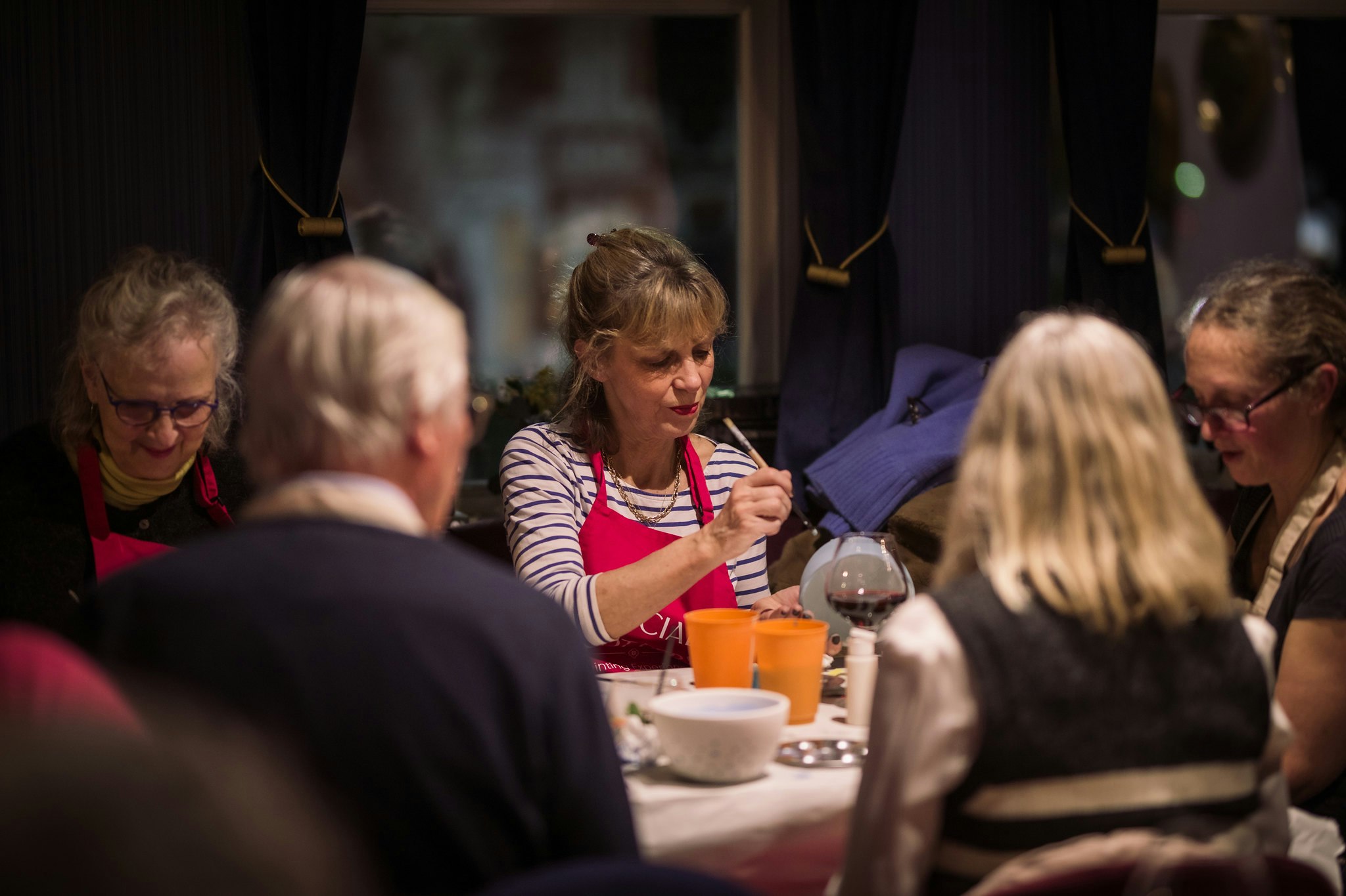 A social group of Members enjoy a complimentary pottery class in the cinema Lounge.