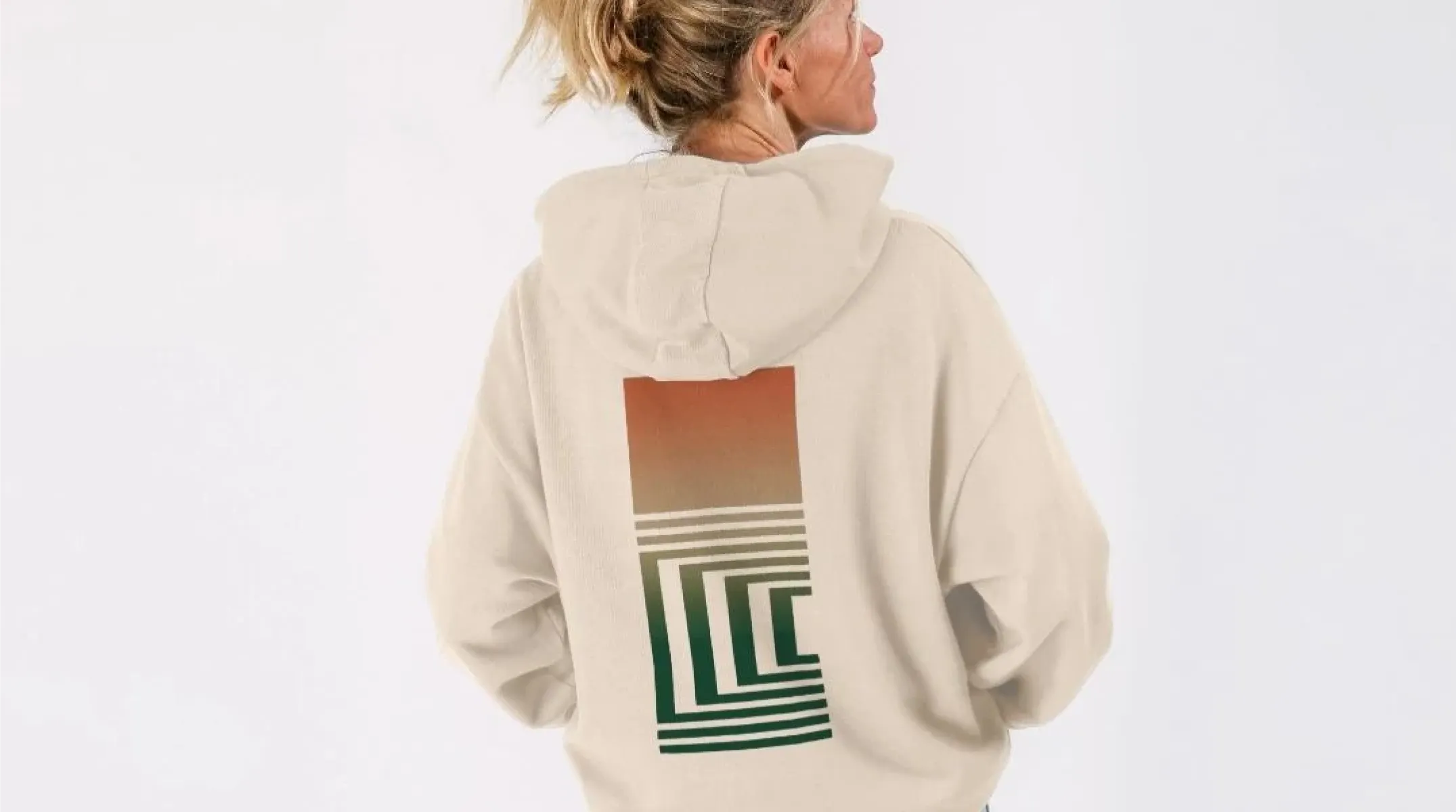 Person wearing a cream Glasgow Film Festival hoodie with the festival graphic on the back
